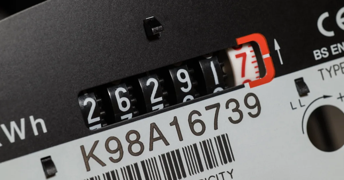 Close-up of an electricity meter showing kWh dials.