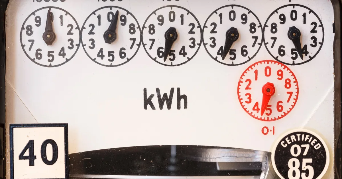 Close-up of electricity meter dials.