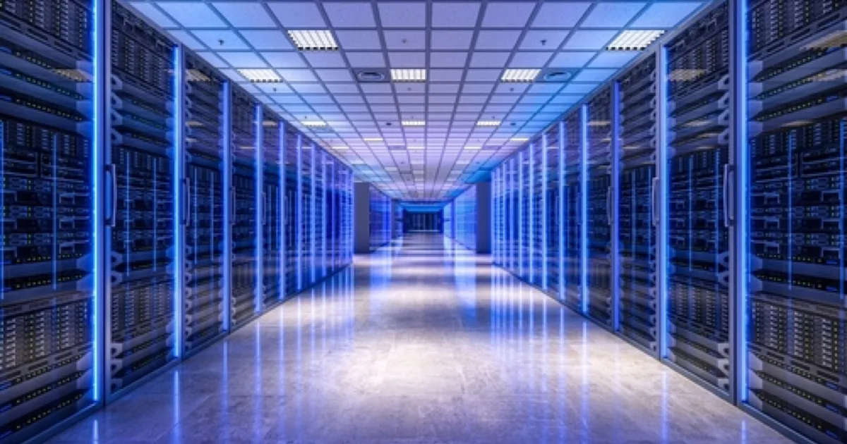 Server racks lining a data centre corridor.