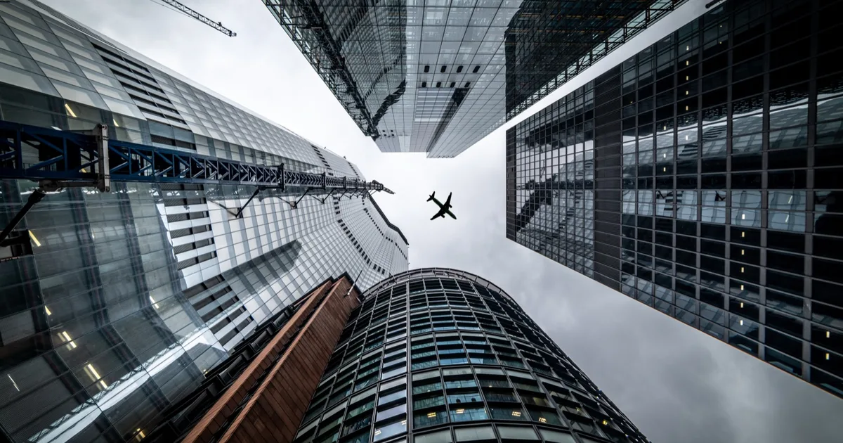 Upward view of glass skyscrapers in a city business district.